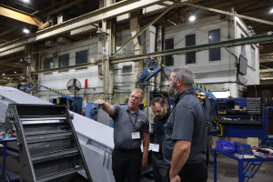 Jeff Michael, Andy Wasilewski, Mark Peterson from CEG in the Mayfran factory.